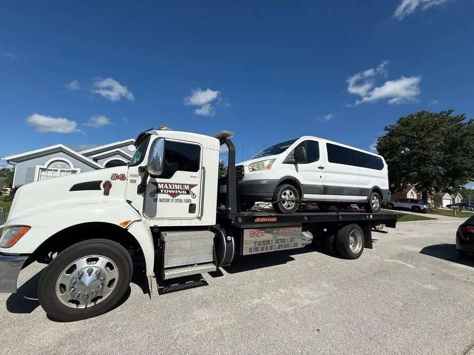 Kenworth flatbed with a van — Maximum Towing